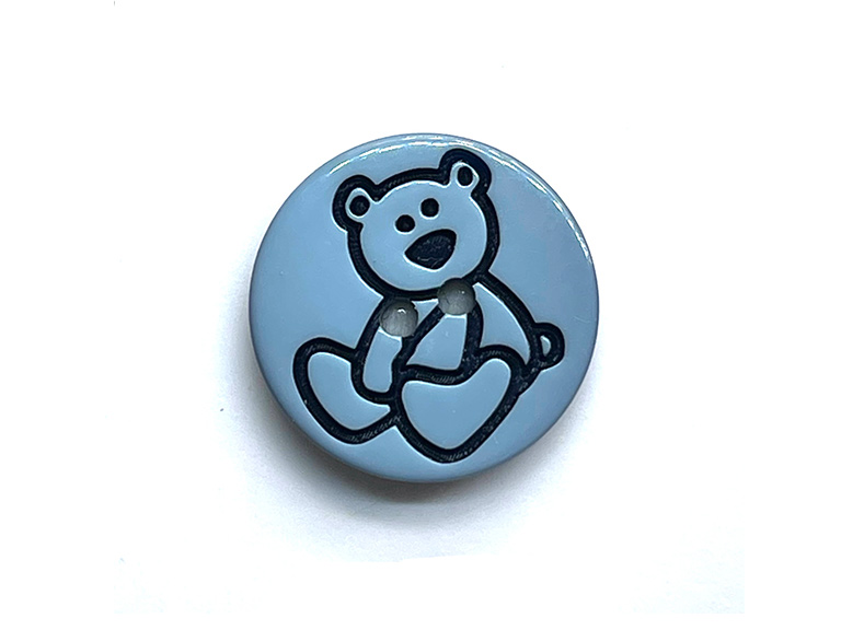 Ein Kinderknopf mit Bärenmotiv